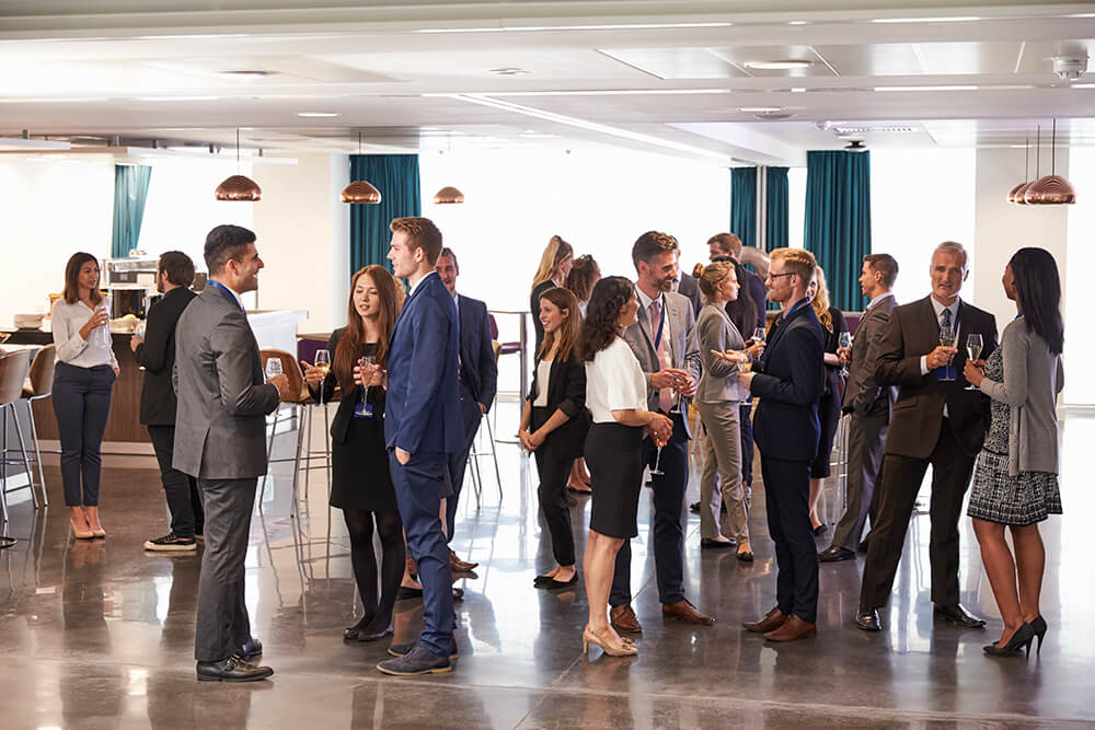 Photo of business professionals talking at a networking reception